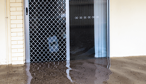 Flooded residential neighborhood illustrating flood zone insurance concerns
